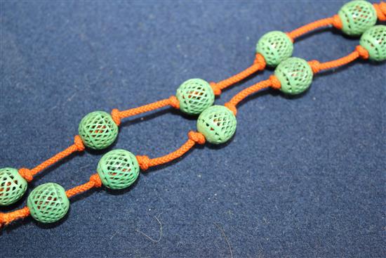 A cricket cage and a silk and ivory bead necklace, pendant & brooch